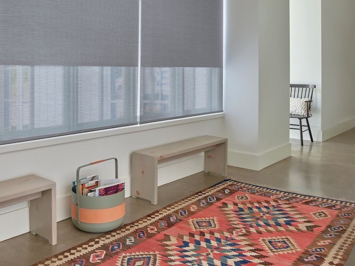 A hallway with a colorful rug.